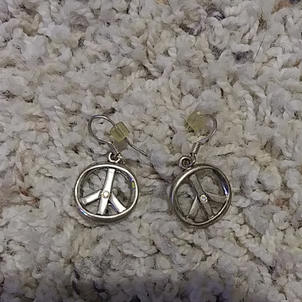 Silver peace earrings with a jewel in the middle